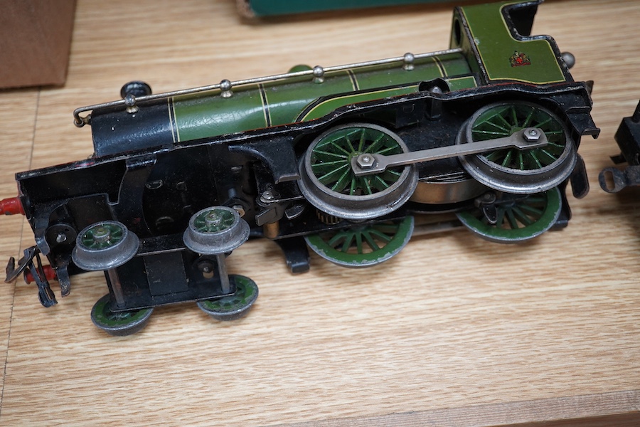 A Bing for Bassett Lowke 0 gauge tinplate clockwork LNER Ivatt 4-4-0 tender locomotive, 4390, together with an early Hornby clockwork 0-4-0, 2710, in GNR green livery with Meccano Ltd roundels to locomotive splasher and